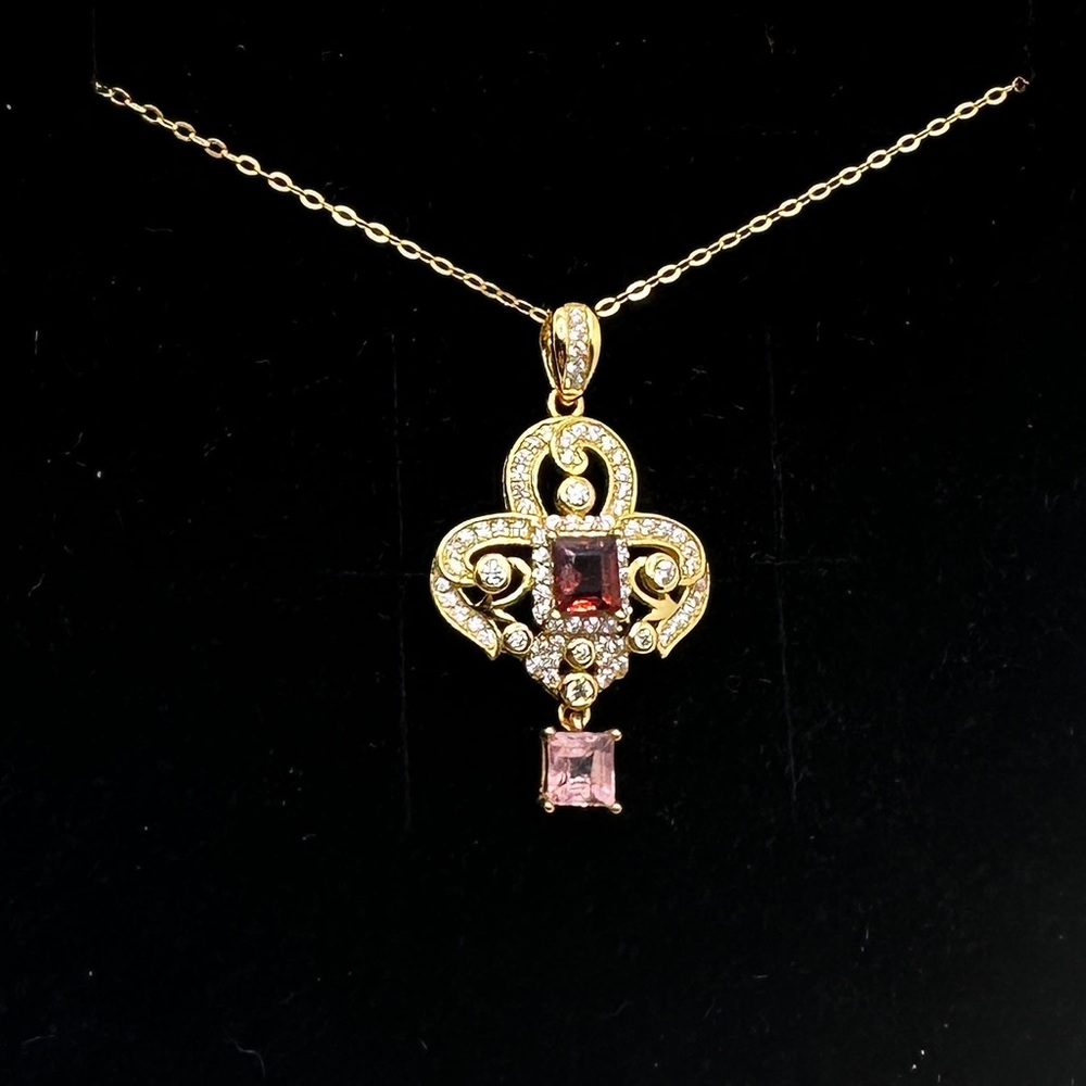 Natural red and pink spinel pendant set in 18 over sterling silver
